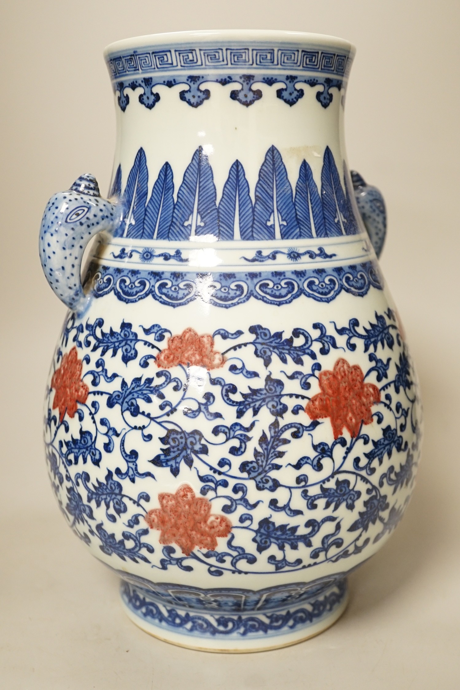 A Chinese underglaze blue and copper red two-handled vase. 31cm tall